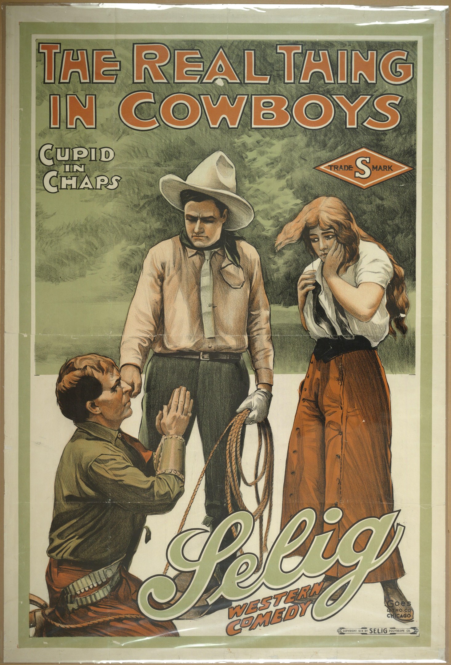 Plakat an einer Wand mit drei Personen, zwei Männern mit Cowboyhüten und einer Frau in einem langen Kleid, mit der Aufschrift "The Real Thing in Cowboys" darüber auf einem hellgelben Hintergrund.