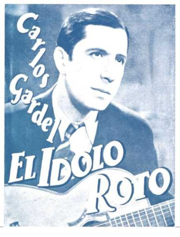 Ein Plakat mit dem spanischen Sänger-Songwriter El Idolo Roro, der eine Gitarre hält, ein weißes Hemd und einen schwarzen Anzug trägt, mit einem ernsten Gesichtsausdruck, zurückgekämmtem Haar und einem hellblauen Hintergrund mit fetter schwarzer Schrift.